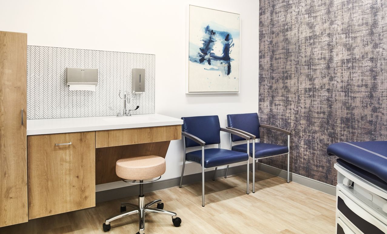 Exam room in a hospital with Textured Woodgrains LVT tiles
