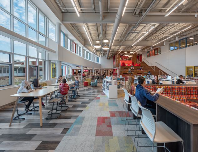 Interface The Standard and Ice Breaker carpet tile with Textured Woodgrains LVT in middle school shared space cafeteria and library