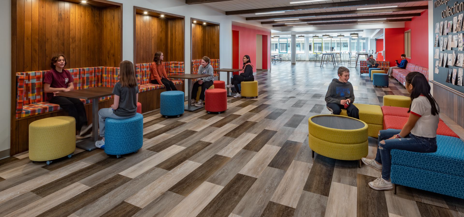 Interface Textured Woodgrains plank LVT in K-12 public space with students on colorful seating