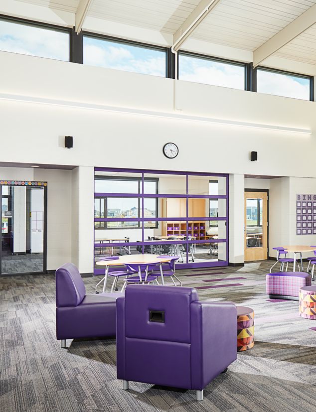 Interface Driftwood and On Line plank carpet tile in seating area of K-12 facility