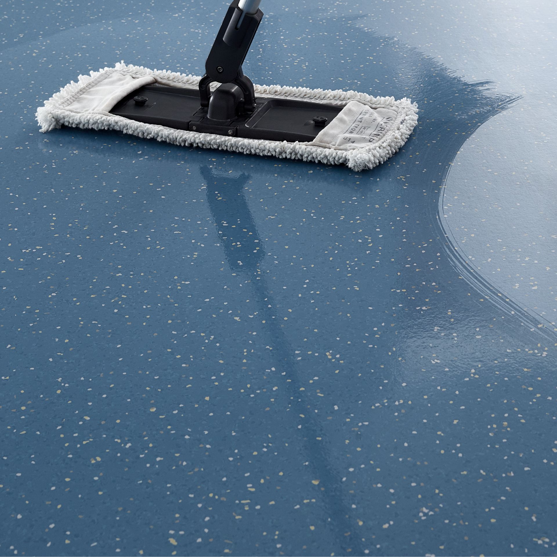 noraplan signa flooring is wiped with a mop and shines where wet