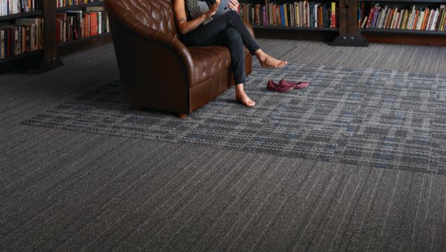 Interface WW860 plank carpet tile and FLOR Scottish Sett carpet tile in library with couch