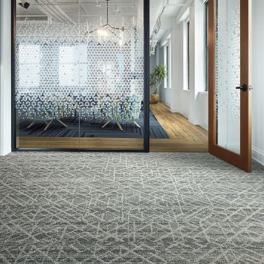 Interface Aglow and Glisten plank carpet tile with Natural Woodgrains LVT in modern office