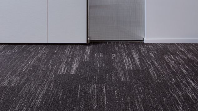 Interface Darning plank carpet tile in small area with white walls