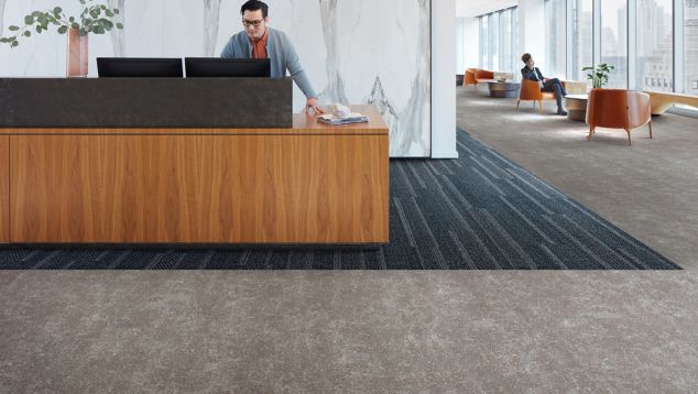 Interface Simple Sash plank carpet tile and Walk of Life LVT in a corporate lobby area with front desk 