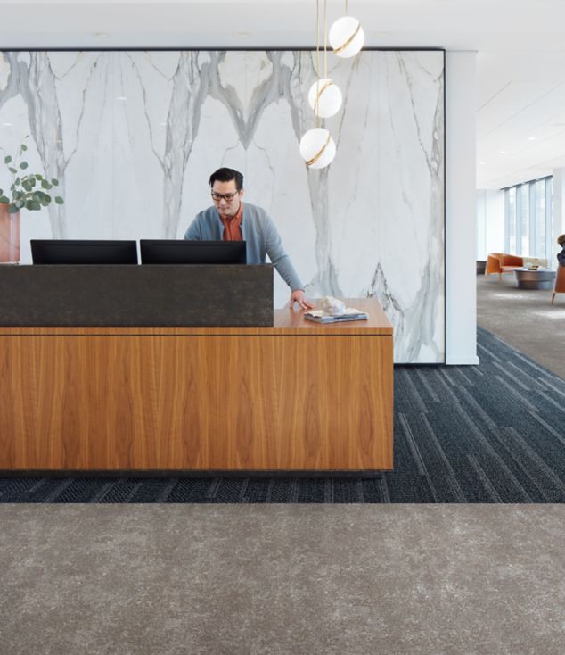 Interface Simple Sash plank carpet tile and Walk of Life LVT in a corporate lobby area with front desk 