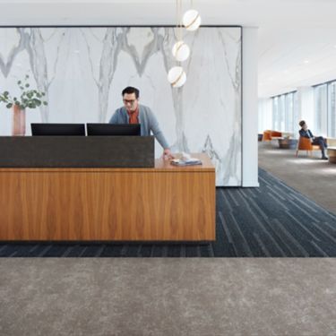 Interface Simple Sash plank carpet tile and Walk of Life LVT in a corporate lobby area with front desk 