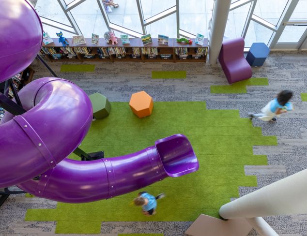 Interface, HN830, HN840 and HN850 plank carpet tile in K-12 library with coiled purple slide