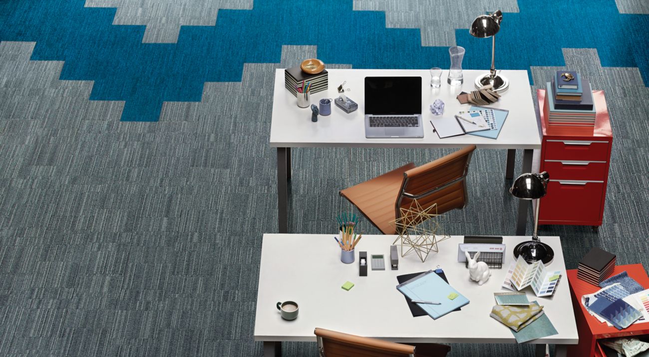 Aerial view of Interface B702 plank carpet tile in open office with red filing cabinets