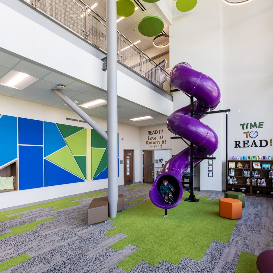 Interface HN830, HN840 and HN850 plank carpet tile in K-12 library with purple slide