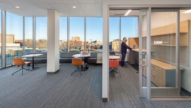 Interface WW880 plank carpet tile in university workroom with glass walls