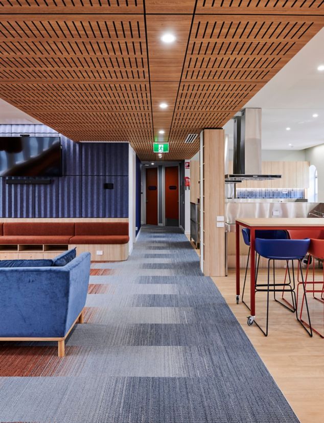 Interface WG100 and WG200 carpet tile with Textured Woodgrains plank LVT in student lounge