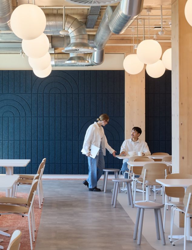 Interface Level Set Textured Stones LVT with Escarpment carpet tile in workplace breakroom