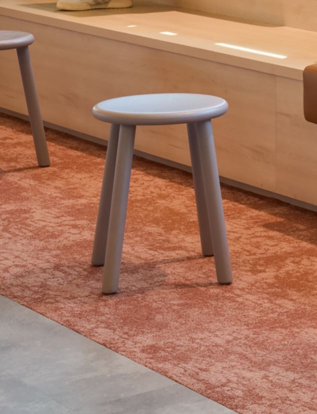 Detail shot of Interface Level Set Textured Stones LVT with Escarpment carpet tile in workplace collaborative space