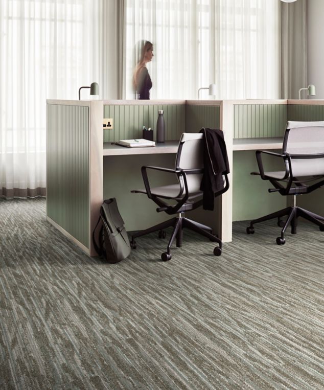 Interface Another Angle plank carpet tile in open office with woman walking