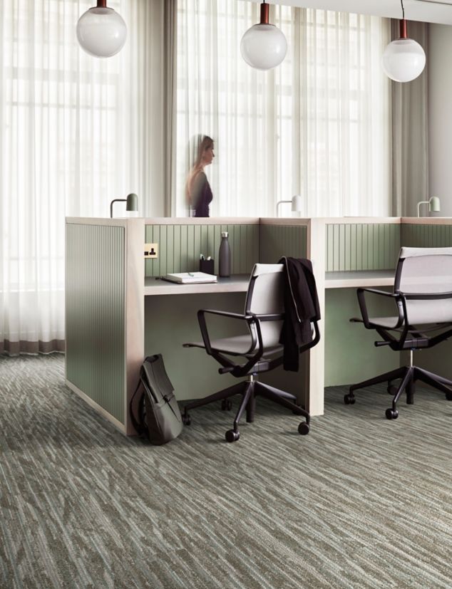 Interface Another Angle plank carpet tile in open office with woman walking