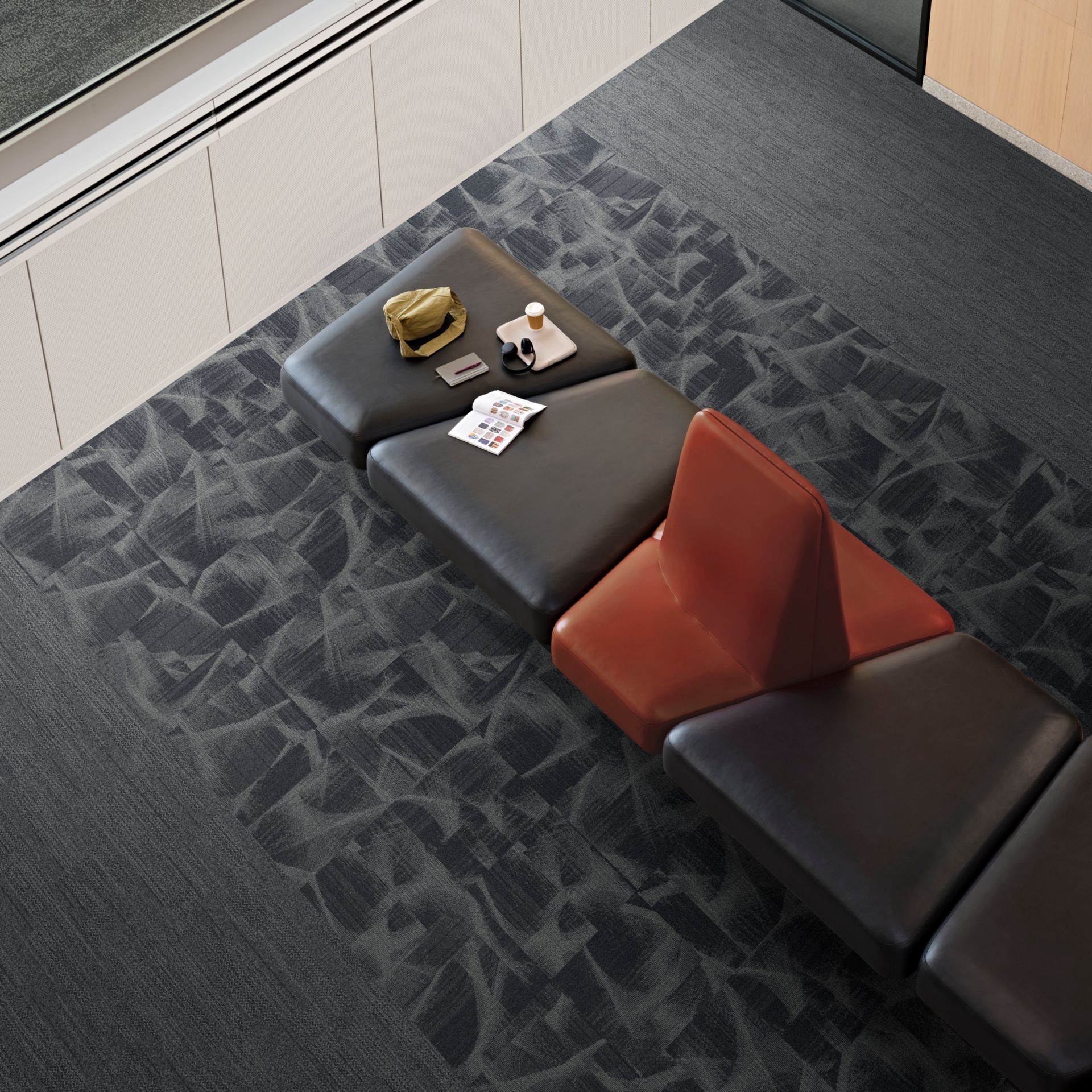 Aerial view of Interface Overtone carpet tile with Tempo Trace and Soft Measure plank carpet tile in workplace lobby