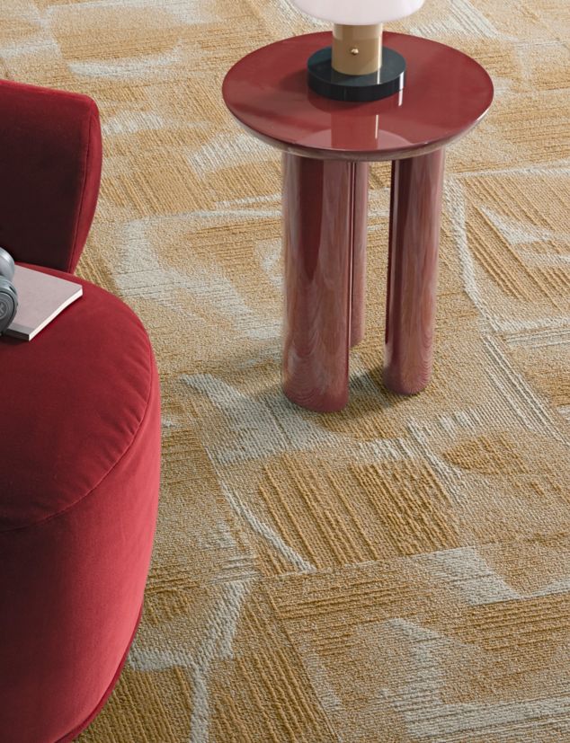Interface Overtone carpet tile in workplace seating area with headphones on chair