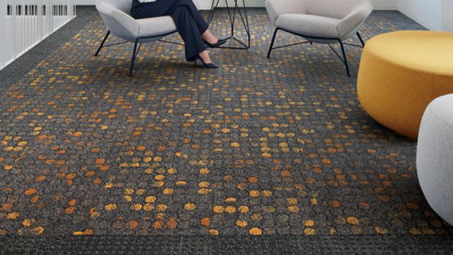 Interface Broome Street and Wheler Street carpet tile in lobby area with woman seated