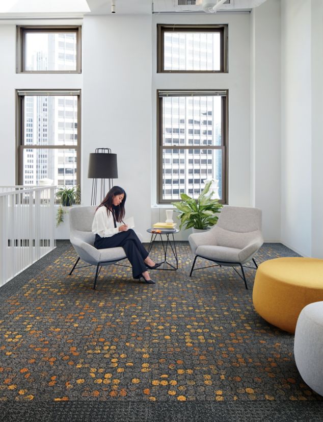 Interface Broome Street and Wheler Street carpet tile in lobby area with woman seated