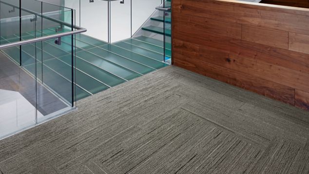 Interface CE172 plank carpet tile in area with reception desk and stairwell