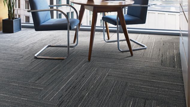 Interface CE172 plank carpet tile in office area with small table and chairs