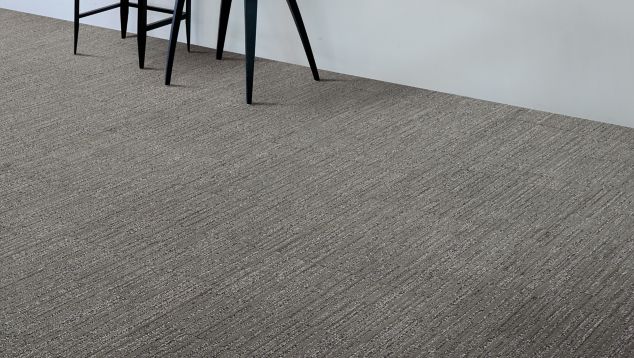 nterface CT102 carpet tile in corridor with chair and small table