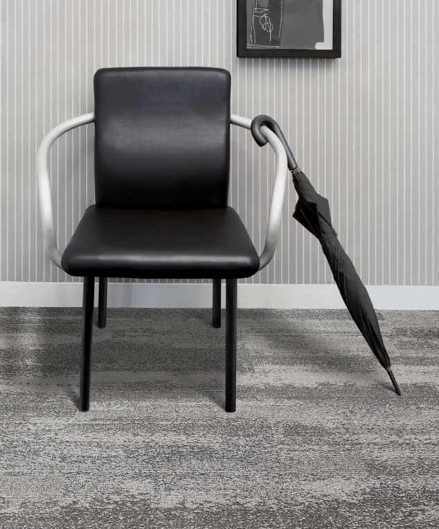 Interface CT112 plank carpet tile in room with black chair and umbrella