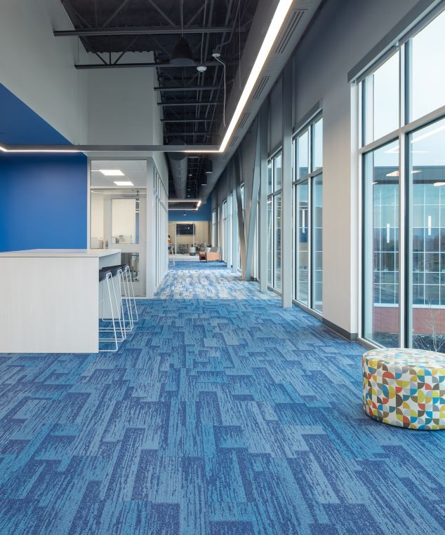 Interface Aerial Flying Colors AE315 and AE317 plank carpet tile in middle school corridor and classroom