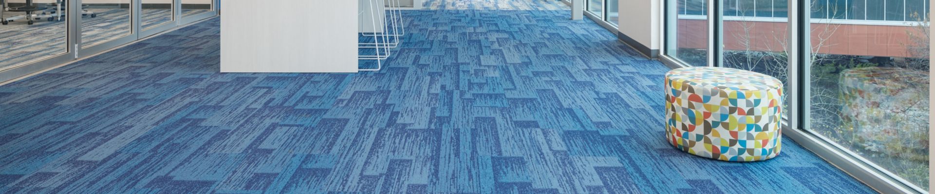 Interface Aerial Flying Colors AE315 and AE317 plank carpet tile in middle school corridor and classroom