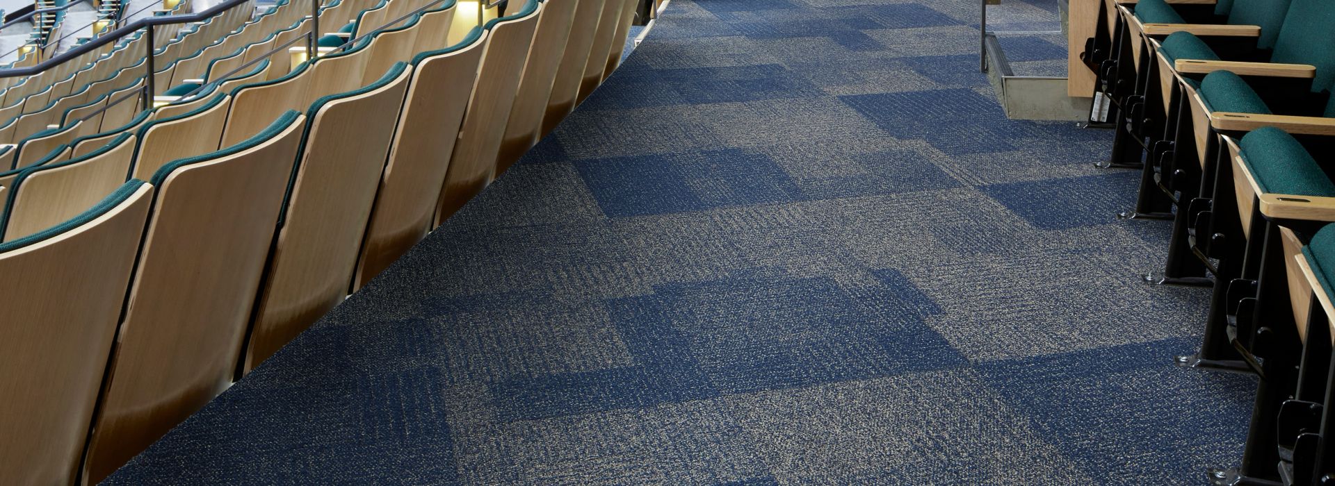 Interface Come and Go carpet tile in theater seating area with wood ceiling