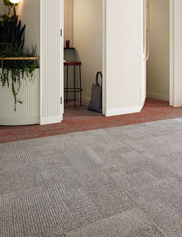 Interface Come and Go carpet tile with Free Reign plank carpet tile in workplace corridor and private booths