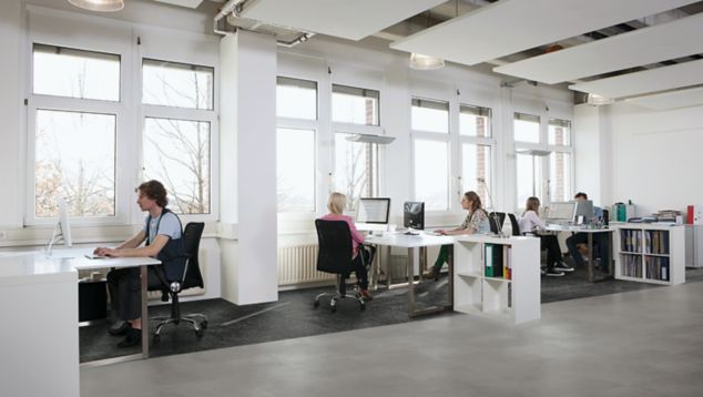 Interface Steady Stride Concretes LVT and Ice Breaker carpet tile in office workspace with cubicles