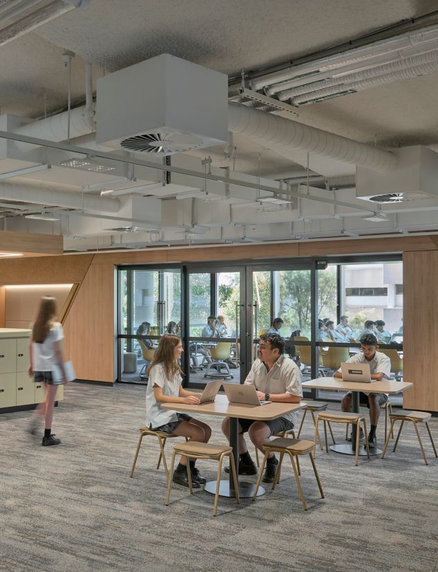 Interface Shallows and Undulating Water carpet tile in high school library