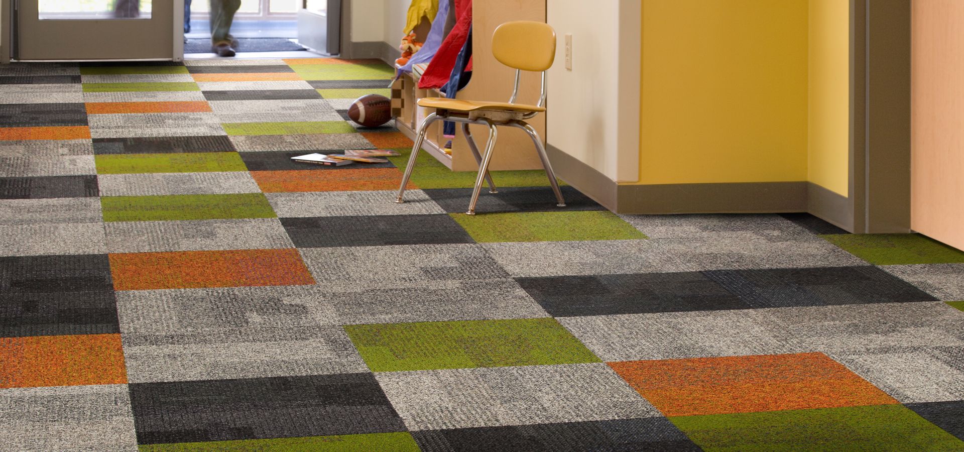 Interface Cubic and Cubic Colours in elementary school entryway with students walking through doors