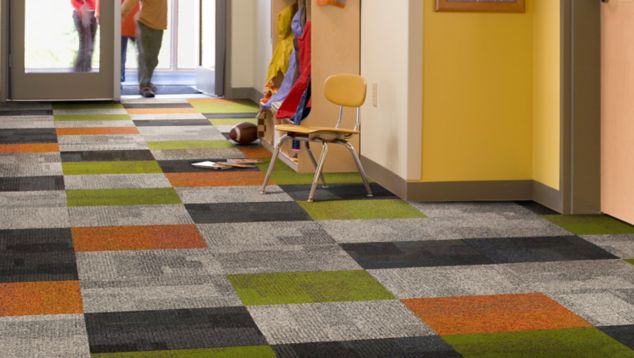 Interface Cubic and Cubic Colours in elementary school entryway with students walking through doors