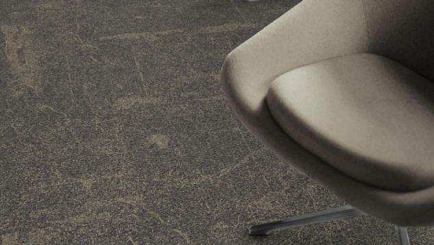 Detail of Interface DL907 carpet tile with chair