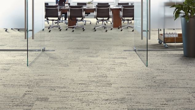 Interface Darning plank carpet tile in meeting area with man leaning over table