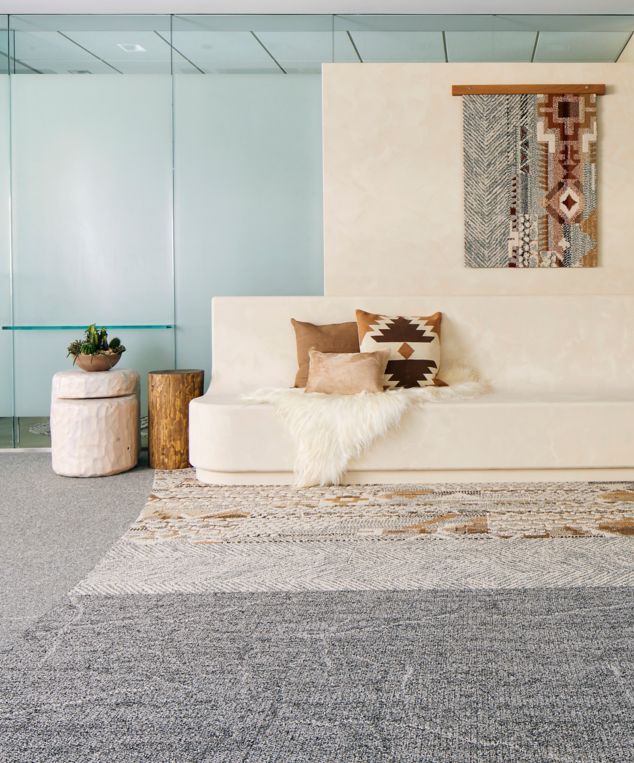 Interface Desert Ranch, Keys View and Desert Veins plank carpet tile with Third Space 301 carpet tile in lobby with wood ladders and tapestry on wall