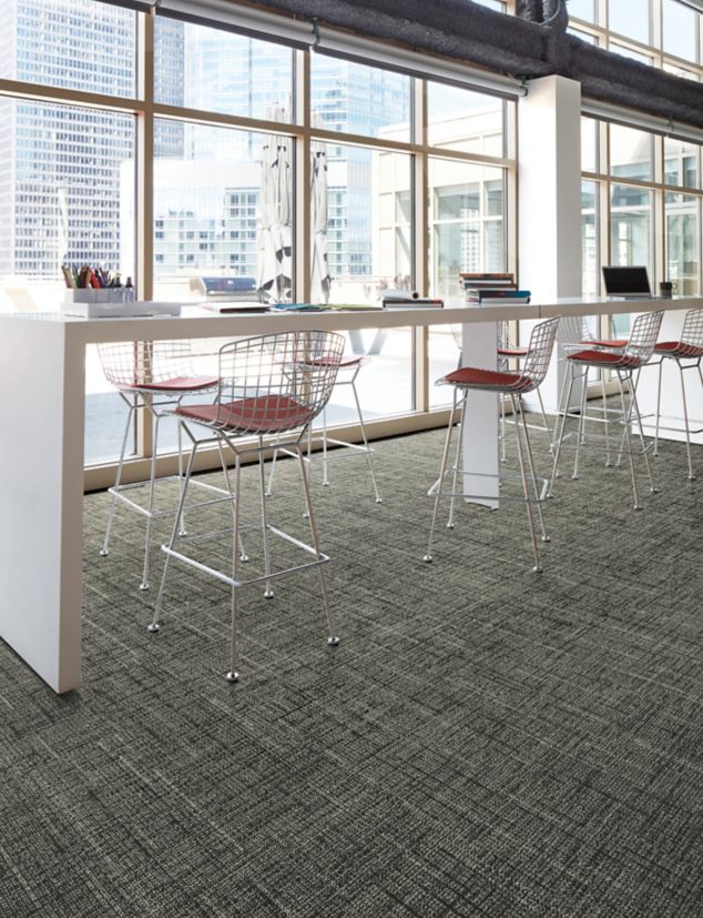 Interface Diminuendo plank carpet tile in seating area with glass windows