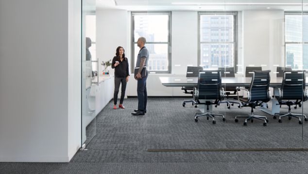 Interface Dover Street and Mercer Street carpet tile in open meeting room with glass doors
