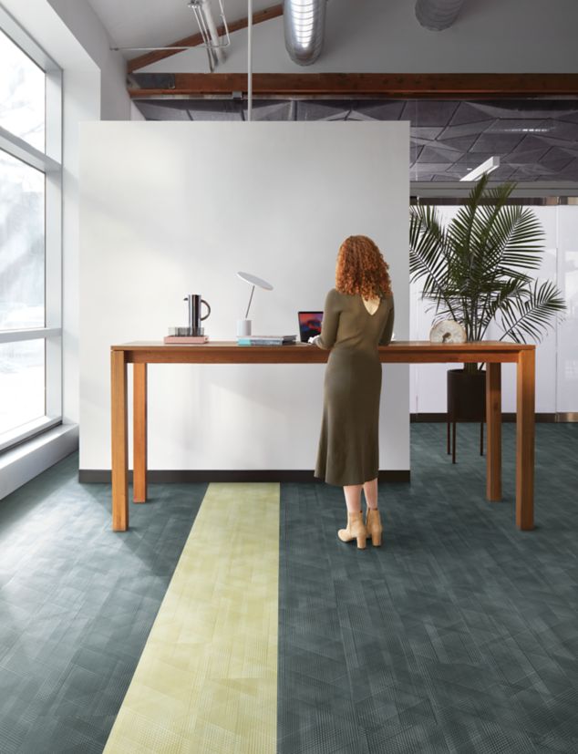 Interface Drawn Lines LVT in office common area with high table 