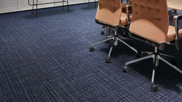 Interface Duplex carpet tile and Textured Stones LVT in meeting area with whiteboard