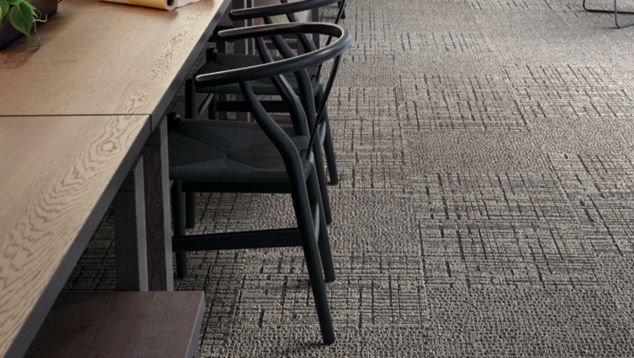 Interface Duplex and Sublet carpet tile in large seating area with long table surrounded by chairs