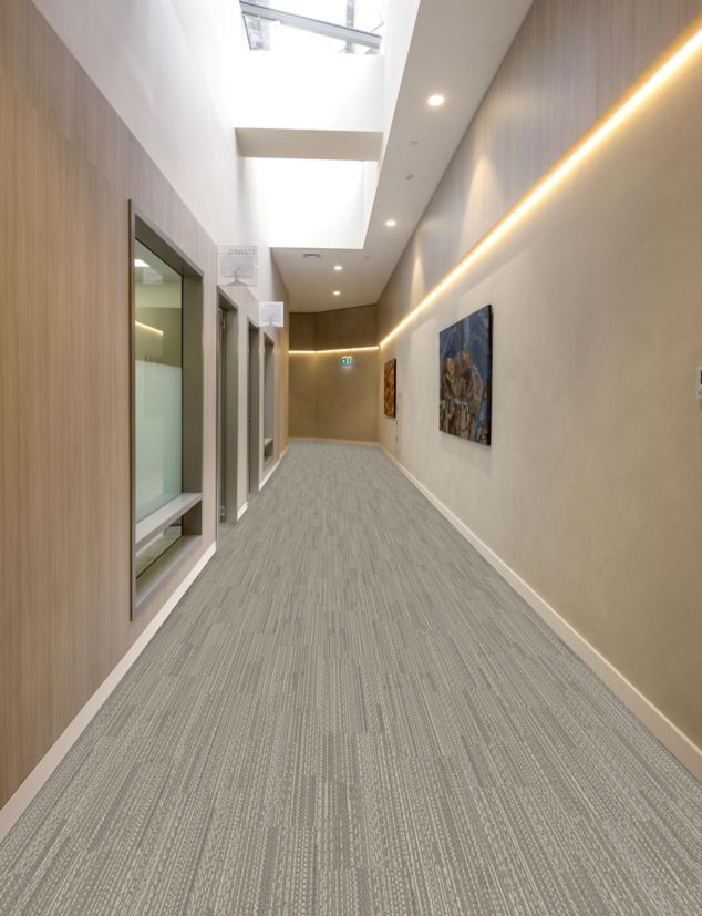 Interface E614 plank carpet tile in corridor with wood tones