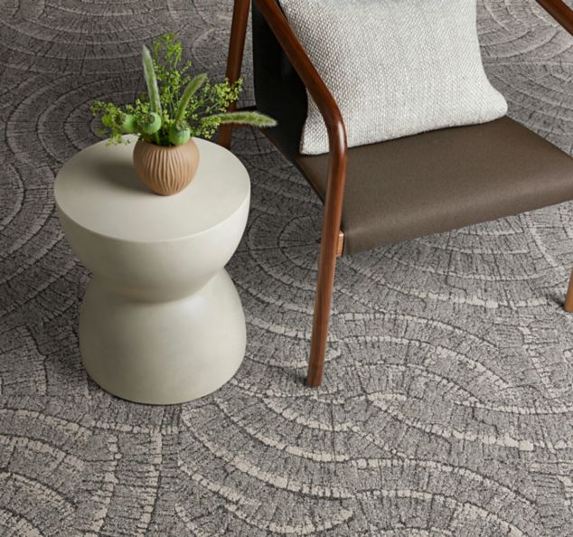 Interface EE710 carpet tile with chair and small table