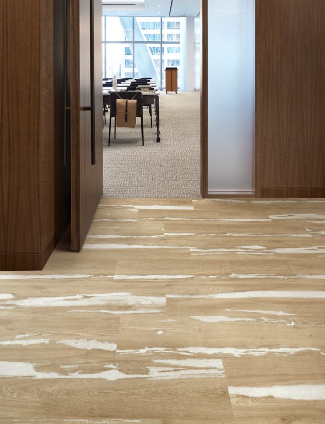 Interface Crossroads plank LVT with E616 plank carpet tile in corporate corridor and meeitng room