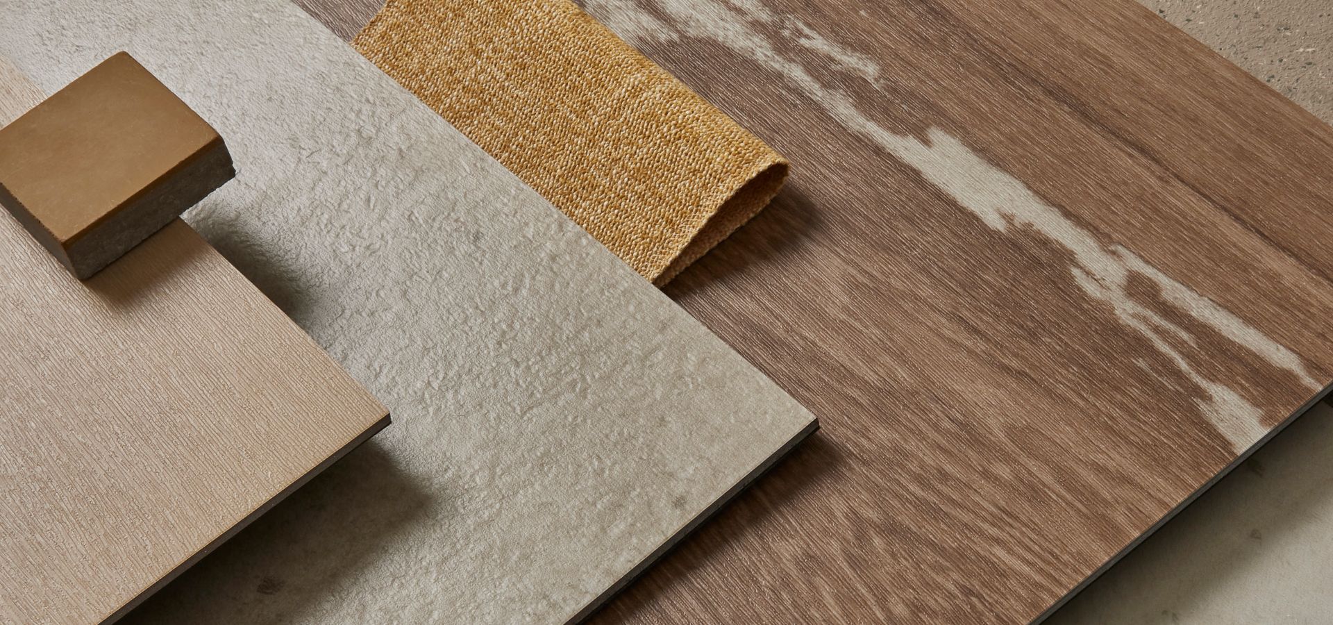 Tabletop palette of Interface Earthen Form LVT with norament castello rubber