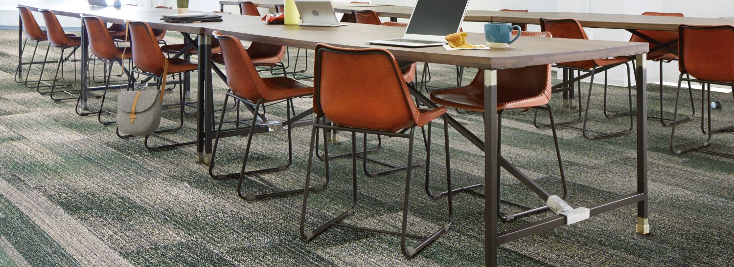 Interface Effervescent and Moving Tints plank carpet tile in open classroom