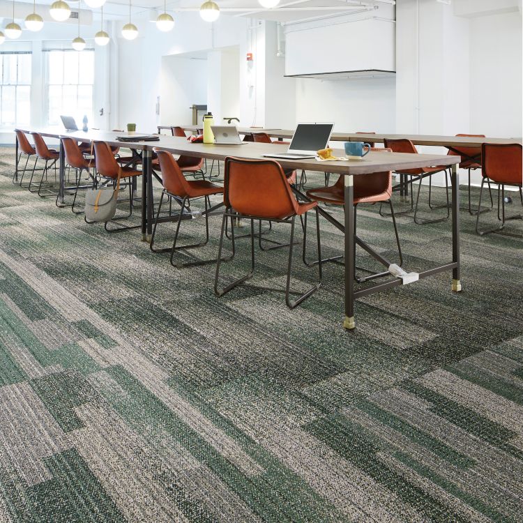 Interface Effervescent and Moving Tints plank carpet tile in open classroom